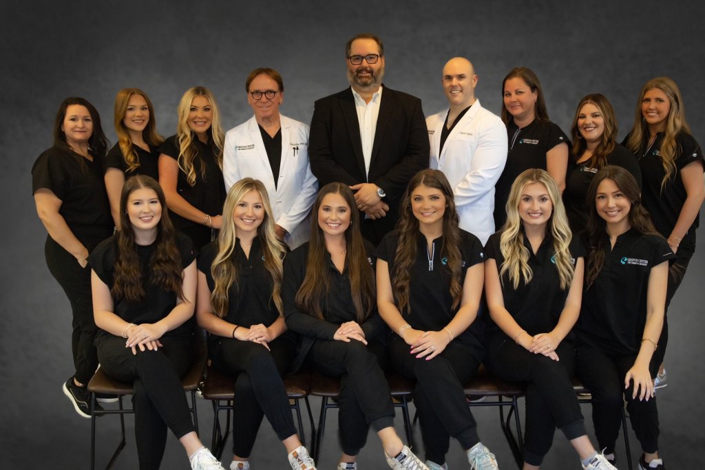 Griffin Center for Cosmetic Surgery practice team photo with providers in white coats and staff in black professional attire.